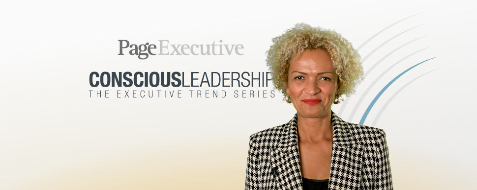 Person in houndstooth jacket smiling, with PageExecutive and Conscious Leadership text in background