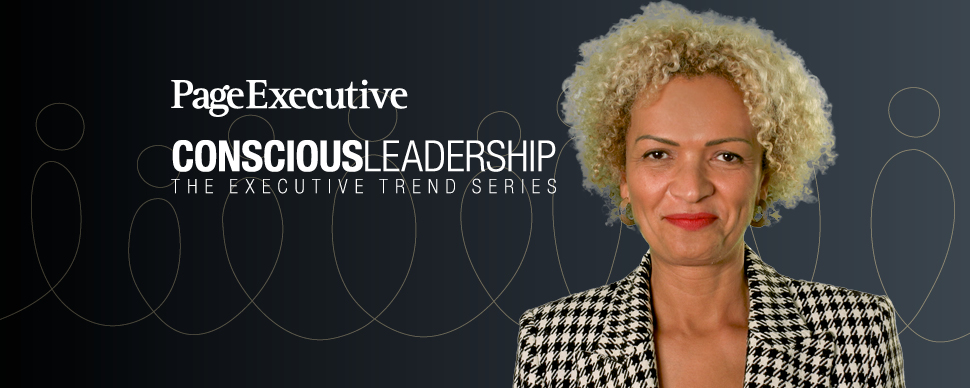 Individual smiling against a backdrop with 'Conscious Leadership' text.
