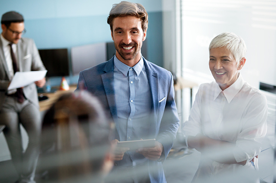 People in a modern office setting having a lively discussion.
