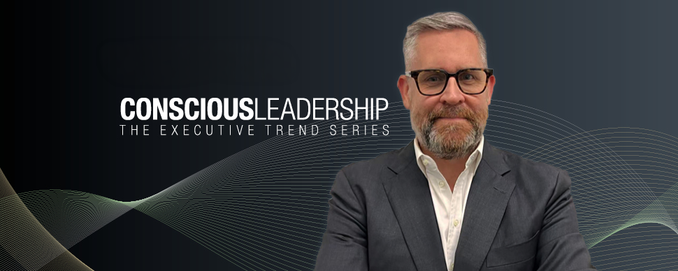Man in a suit and glasses with 'Page Executive Conscious Leadership: The Executive Trend Series' text in the background.