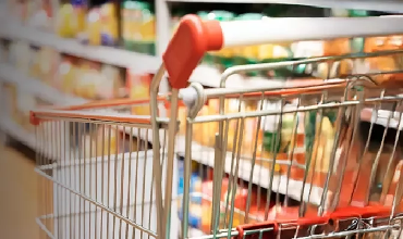 shopping cart with a supermarket background
