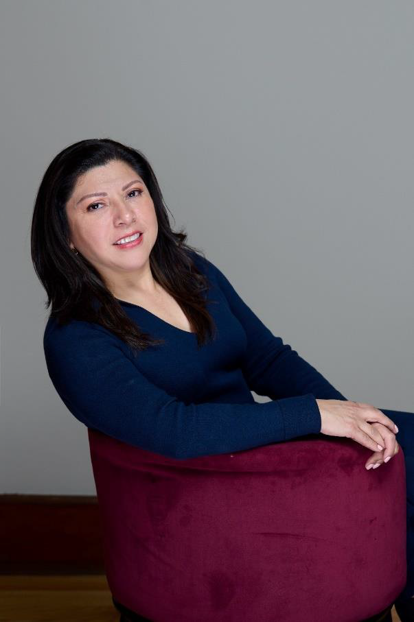 a woman holding a skate board 