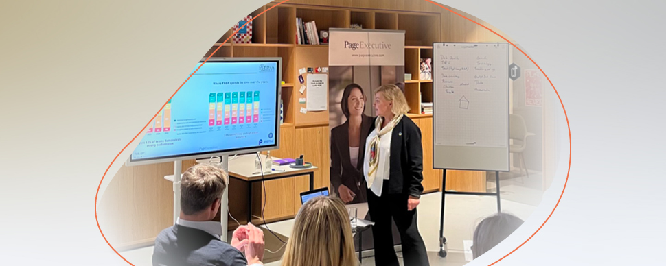 a woman presenting in a conference room