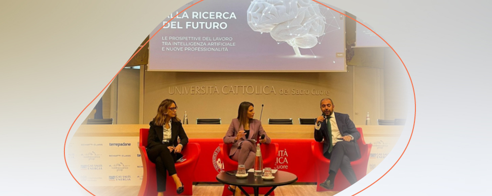 Three people giving a lecture at a university