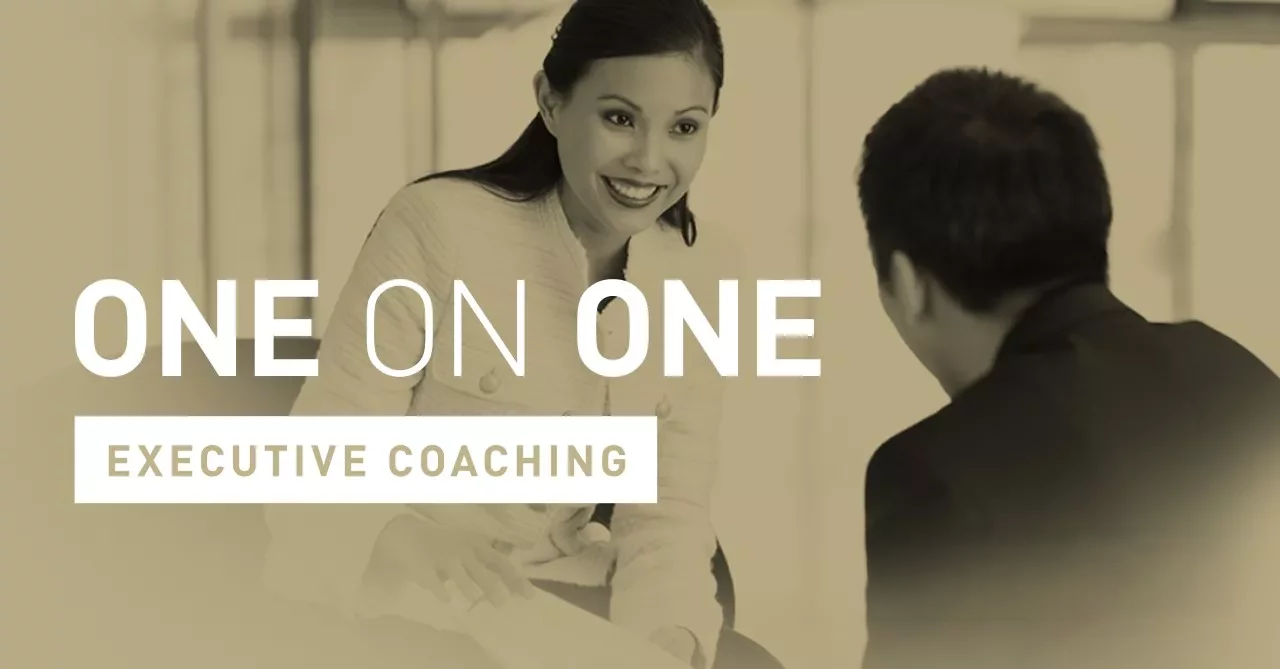 Two people engaging in executive coaching