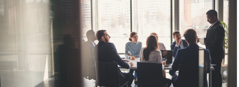 People meeting around a conference table.