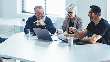 a woman and a man smiling next to the title: How to build a sustainability function in your business