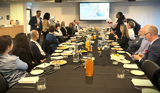 a group of people sitting in a conference room