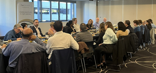 a group of people sitting in a conference room