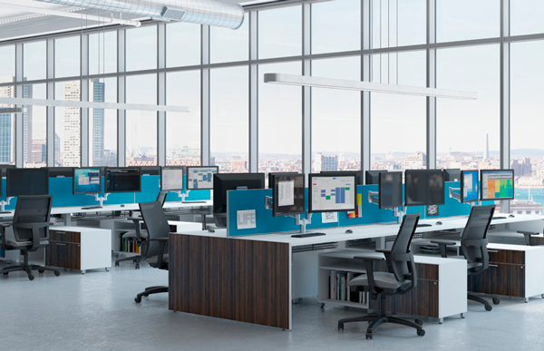Modern office with large windows and rows of desks with computers.