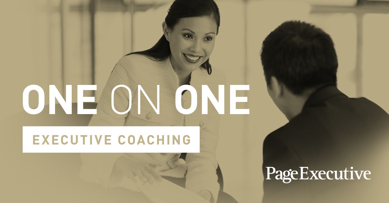 Two people engaging in executive coaching