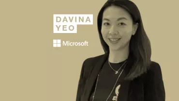 Person smiling in front of a beige background with text: Davina Yeo, Microsoft.