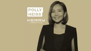 Person in a professional attire with a logo of Polly Heiss Kerry Logistics.