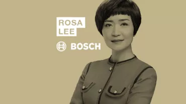 Person in business attire with a short hairstyle, next to the words 'Rosa Lee Bosch' on a beige background.