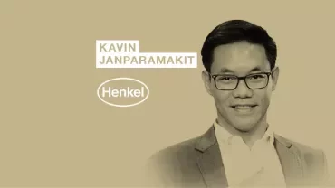 Individual smiling with Henkel logo and name displayed.