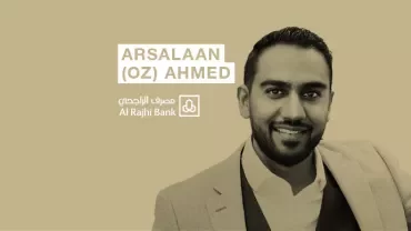 Person in a suit with a logo and text of Al Rajhi Bank.