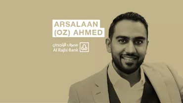 Person in a suit with a logo and text of Al Rajhi Bank.