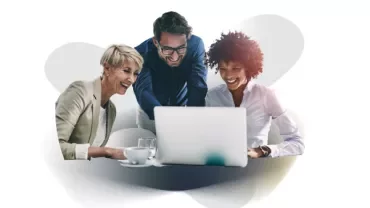 People huddled around a computer