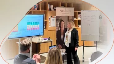 a woman presenting in a conference room