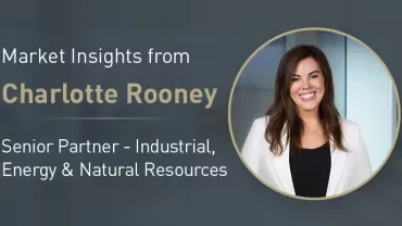 Promotional graphic featuring a person in a white jacket next to the text ‘Market Insights from Charlotte Rooney – Senior Partner, Industrial, Energy &amp; Natural Resources.’