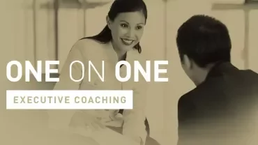 Two people engaging in executive coaching