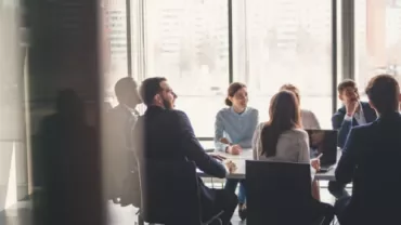 People meeting around a conference table.