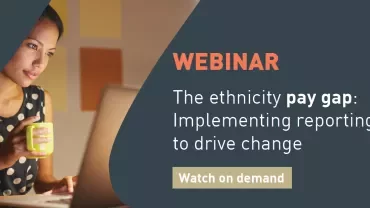 Person watching a webinar on pay gap reporting.