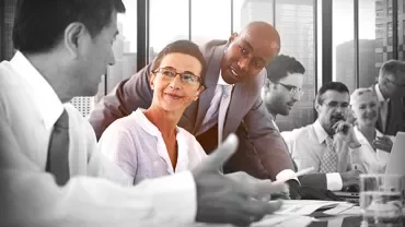 Group of professionals having a meeting in a modern office.