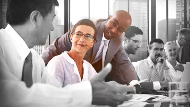 Group of professionals having a meeting in a modern office.