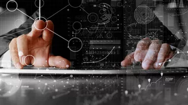Person interacting with digital interface showing graphs and data analysis.
