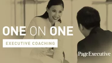 Two people engaging in executive coaching