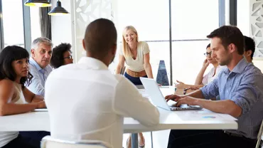A group of professionals having a meeting in a modern office.