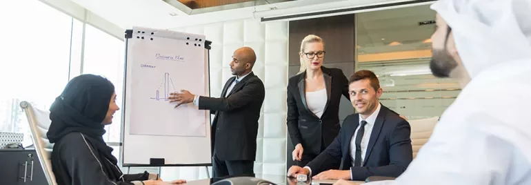 Business meeting with presentation in modern office.
