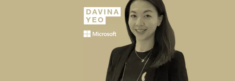 Person smiling in front of a beige background with text: Davina Yeo, Microsoft.