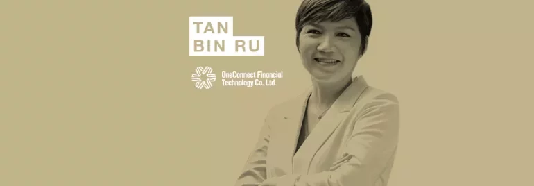 Person smiling in a white jacket, with logos and text on a beige background.
