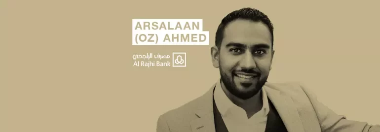 Person in a suit with a logo and text of Al Rajhi Bank.