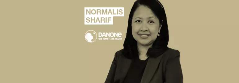Person smiling with Danone logo and text 'Normalis Sharif'.