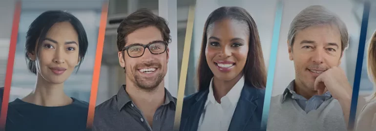A diverse group of people smiling in a professional setting.