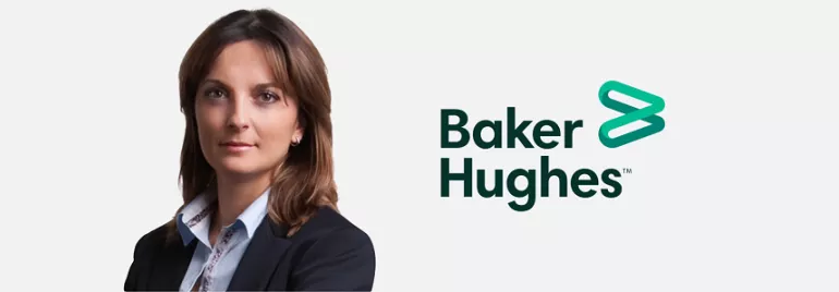 Person in business attire next to Baker Hughes logo on a white background.