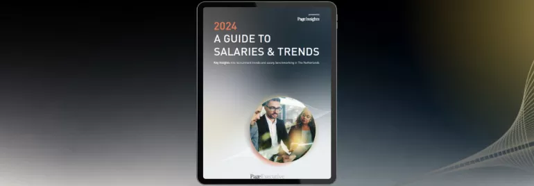 Cover of a 2024 salary and trends guide displayed on a tablet.