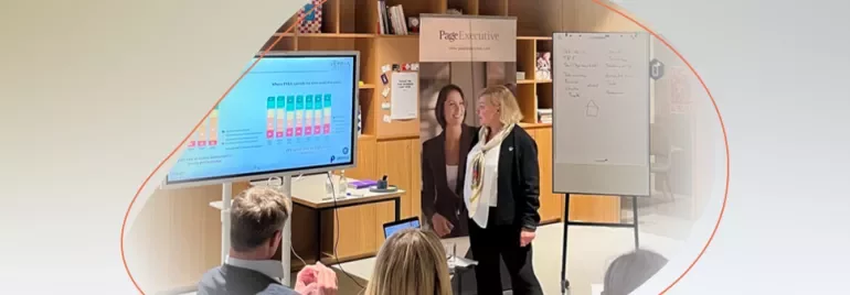 a woman presenting in a conference room