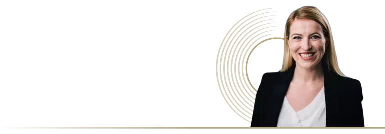 Margaux Perrier smiling in a dark background