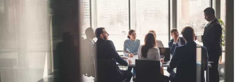 People meeting around a conference table.