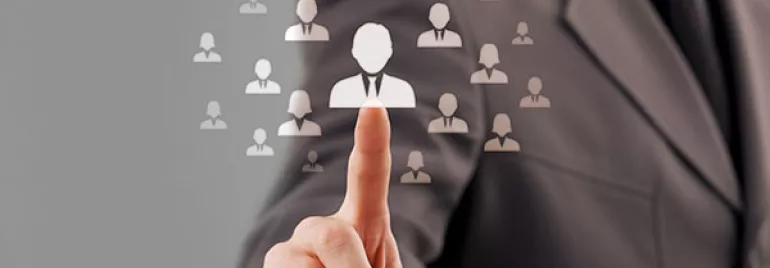 Businessperson selecting an individual icon on a digital screen