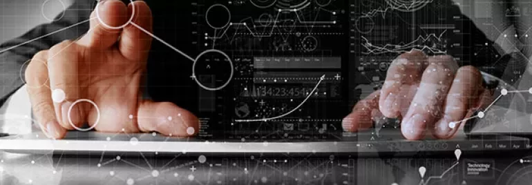 Person interacting with digital interface showing graphs and data analysis.