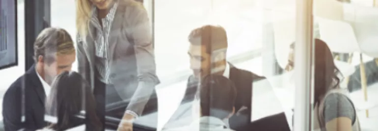 Group of people having a meeting in a bright office.