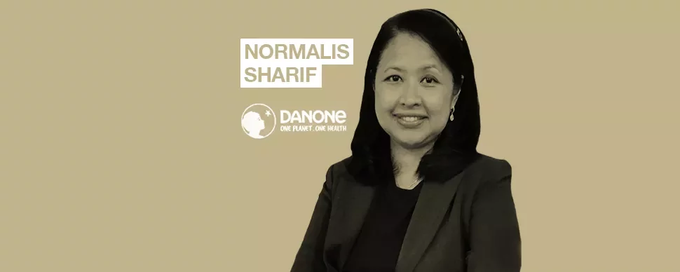 Person smiling with Danone logo and text 'Normalis Sharif'.