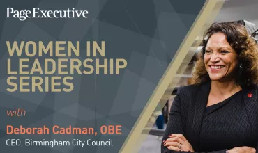 Smiling person at Women in Leadership Series event.