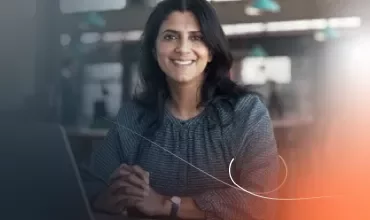 a woman smiling in the office