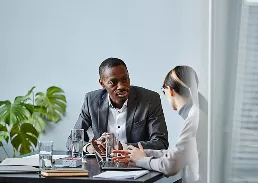 2 people working on a table